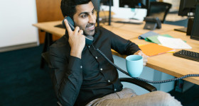 stock photo south asian man on phone